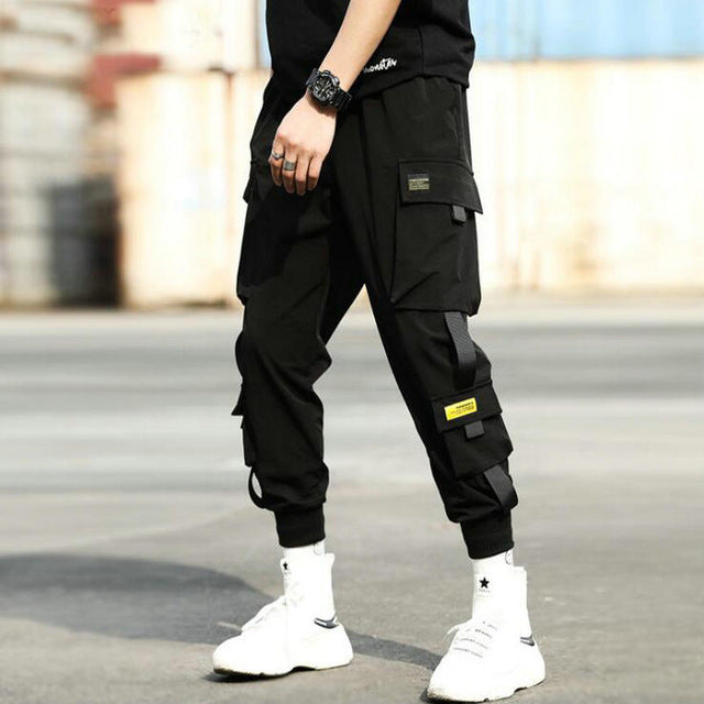 Streetwear hip hop preto harem calças dos homens de cintura elástica calças do punk com fitas casual magro jogger calças de hip hop